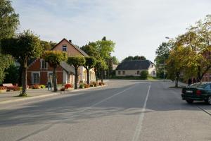 an empty street in a small town with houses at Holiday Apartment in Alūksne +3 photos