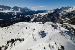 a snow covered mountain with a ski lift on it at Il Terrazzino Val di Sole in Dimaro