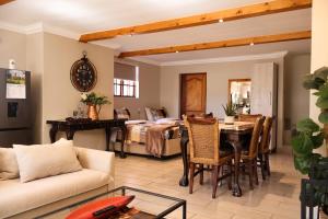 a living room with a couch and a table at The Gables-Clarens in Clarens