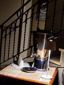 a coffee maker sitting on top of a table at Garni B&B Mozart Nesthouse in Canazei +193 photos