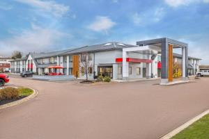 a rendering of a building in a parking lot at Comfort Inn Moncton East in Moncton