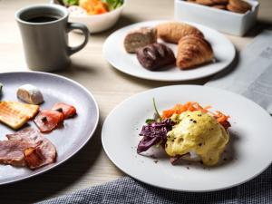 a table with plates of food and a cup of coffee at Hotel Vista Premio Kyoto Nagomi tei in Kyoto