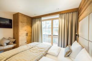 Postel nebo postele na pokoji v ubytování Pepi's Suites - Lechtal Apartments