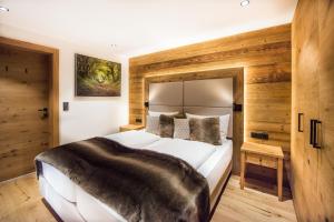 Postel nebo postele na pokoji v ubytování Pepi's Suites - Lechtal Apartments