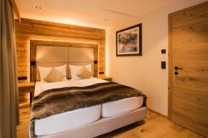 Postel nebo postele na pokoji v ubytování Pepi's Suites - Lechtal Apartments