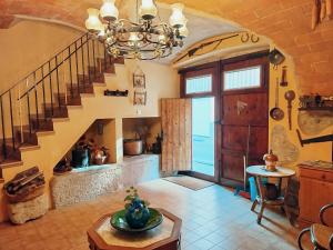 a living room with a staircase and a table at AVI PEP in Vilafant +111 photos