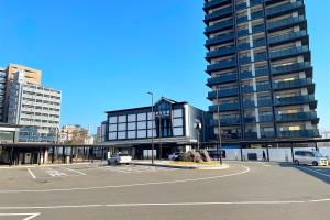a parking lot in front of a large building at Volcano in Kagoshima +22 photos