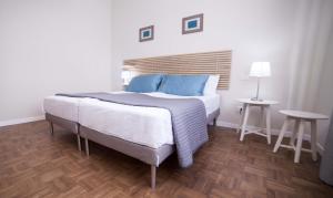 Letto o letti in una camera di Home Scala dei Turchi B&B