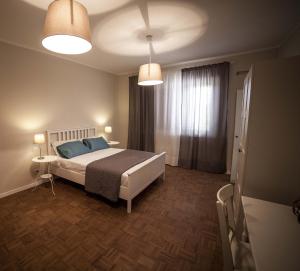 Letto o letti in una camera di Home Scala dei Turchi B&B