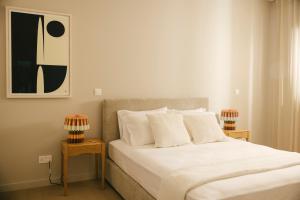 a bedroom with a large bed with two night stands at Pinewood by Holistays in İncirli