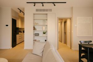 a living room with a couch and a table at Pinewood by Holistays in İncirli