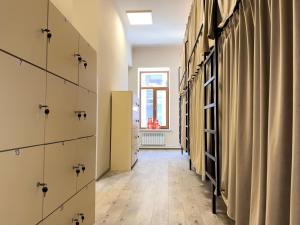 a hallway with drawers and a room with a window at Old Town Hostel Gyumri in Gyumri