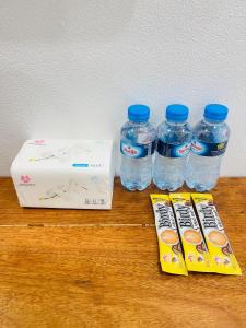 a group of bottles of water sitting on a table at Nongkhiaw Chansai Guesthouse in Nongkhiaw