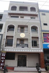 a building with a sign on the front of it at Hotel Lakhdatar in Kota