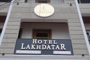 a sign for a hotel lakealdaria on a building at Hotel Lakhdatar in Kota +9 photos