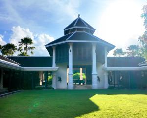 a large house with a grass yard at BB Luxury Villa in Phuket