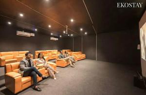 a group of people sitting in an auditorium at EKOSTAY - Noir Villa in Alibaug