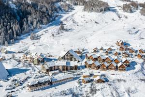 an aerial view of a resort in the snow at les Loulous Réallon in Réallon +4 photos