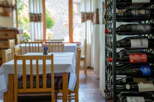 a room with a table and a bunch of wine bottles at Hotel Mirhav in Goris