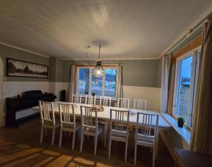 a kitchen and dining room with a table and chairs at Ferienhaus Björkebo in Stöllet