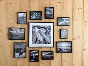a wall with pictures of a man on it at La Moutonniere in Levassaix