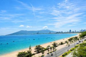 a view of a beach and the ocean at Hong Phuc Hotel 2 Da Nang in Danang +25 photos