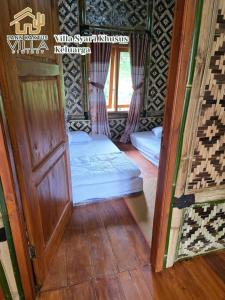 a room with a door and a bed in it at Villa zann kaktus in Nempel +9 photos