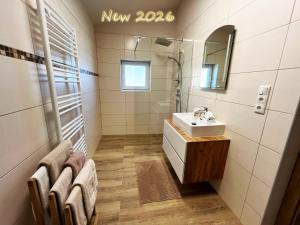 a bathroom with a sink and a mirror at Almhütte Ödenhübl in Katschwald