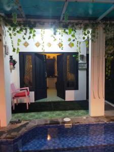 a view of the entrance to a house with a pool at Gandasari Homestay Banyuwangi in Dadapan
