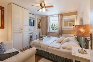a bedroom with a bed and a living room at Čarman House in Bled