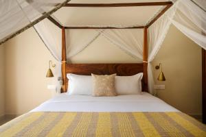 a bedroom with a bed in a tent at Rekawa Wellness Resort in Tangalle +46 photos