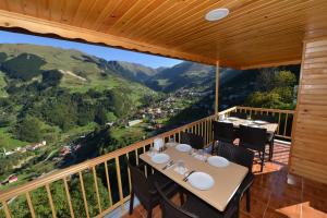 a table and chairs on a balcony with a view at Hamsiköy Seyirtepe Butik Otel in Hamsikoy