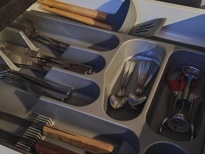 a drawer full of utensils in a sink at Manere commoda in Šiauliai
