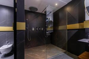 a bathroom with a shower and a sink at Soho Boutique Granada in Granada