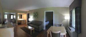 a living room filled with furniture and a tv at Best Western Plus South Coast Inn in Santa Barbara