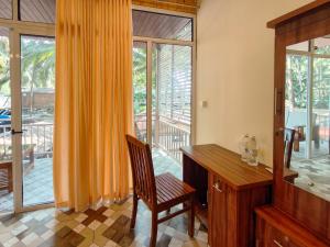 a home office with a desk and a window at The Racha Agonda in Agonda