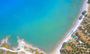 an aerial view of the ocean and a beach at Plaisir Beachside Apts in Agios Nikolaos +35 photos