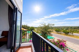 a balcony with a view of a road at Đức Lưu Quang Hotel Bình Thuận in Tuy Phong