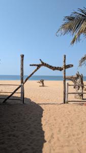 a couple of wooden crosses on the beach at Coco Beach Front Stay & Cafe in Gokarna
