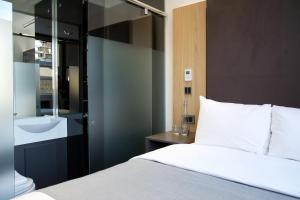 Cama o camas de una habitación en The Z Hotel City