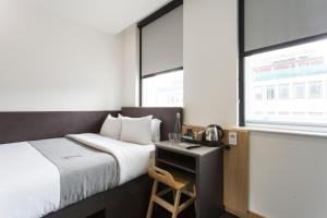 Cama o camas de una habitación en The Z Hotel City
