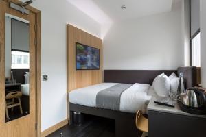 Cama o camas de una habitación en The Z Hotel City