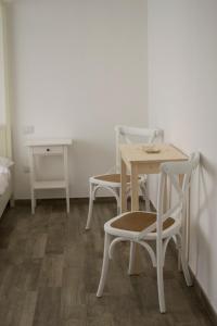 a table and chairs in a room with a table and a table and a table at Il Gelsomino in Roseto degli Abruzzi +19 photos