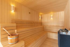 a wooden sauna with a bucket in the middle at Hiddenbay Teos Hotel in Seferihisar