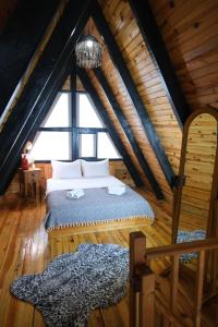 a bedroom with a bed and a large window at AYBELYA TATİL KÖYÜ in Bafra +102 photos