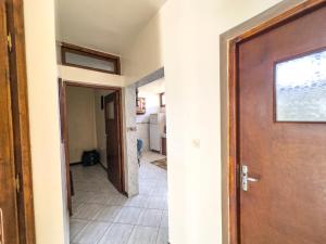 a hallway with a door and a tile floor at Tamraght Waves Retreat 2 in Tamraght Ouzdar
