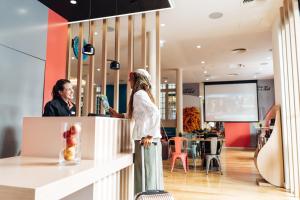 two women standing at a counter in a store at Stay Hotel Lisboa Centro Chiado in Lisbon