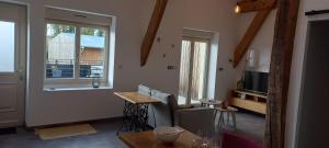 a living room with a table and a window at La Bulle Enchantée in Berru
