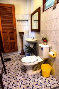 a bathroom with a toilet and a sink at Le mont pai resort in Pai