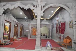 an entrance to a temple with a red carpet at Omji Ashram Jageshwar Mahadev in Varanasi